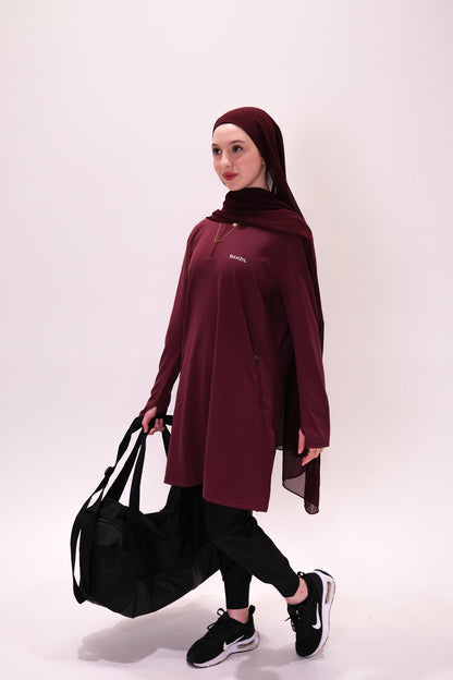 Image of a Muslim woman wearing modest gym wear for hiking and running.